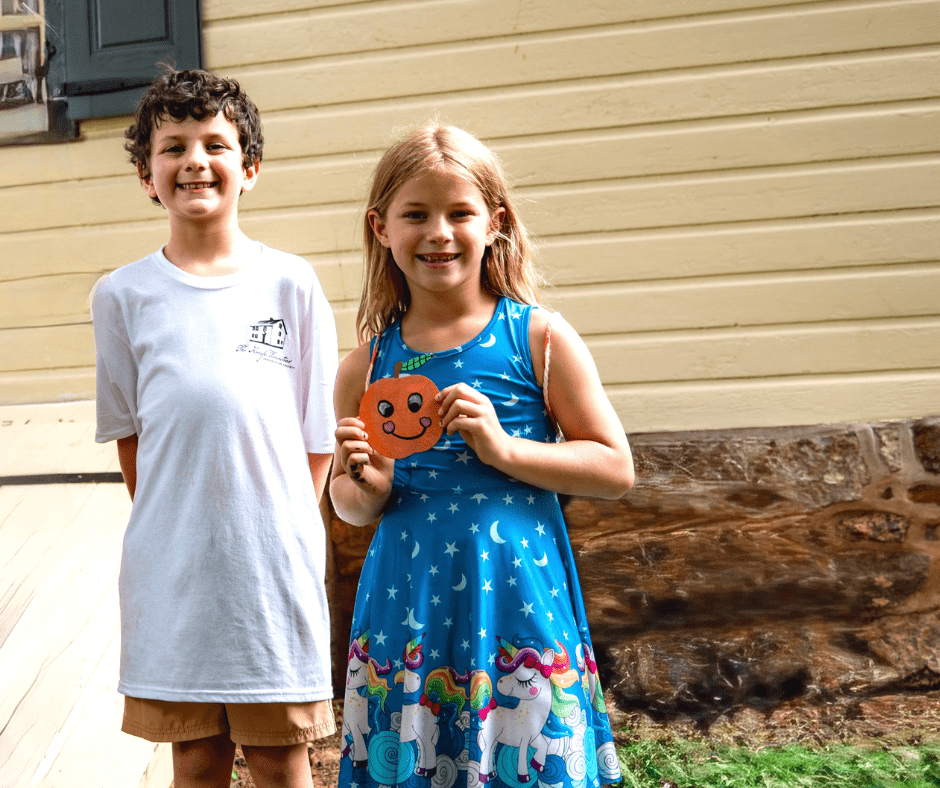 Julianna_Iacocca_Jack_Fischer Knauss descendant Jack Fischer awards the 2025 Peach Festival prize to Julianna Iacocca for her peach painting at the Knauss Homestead Peach Festival in Emmaus.
